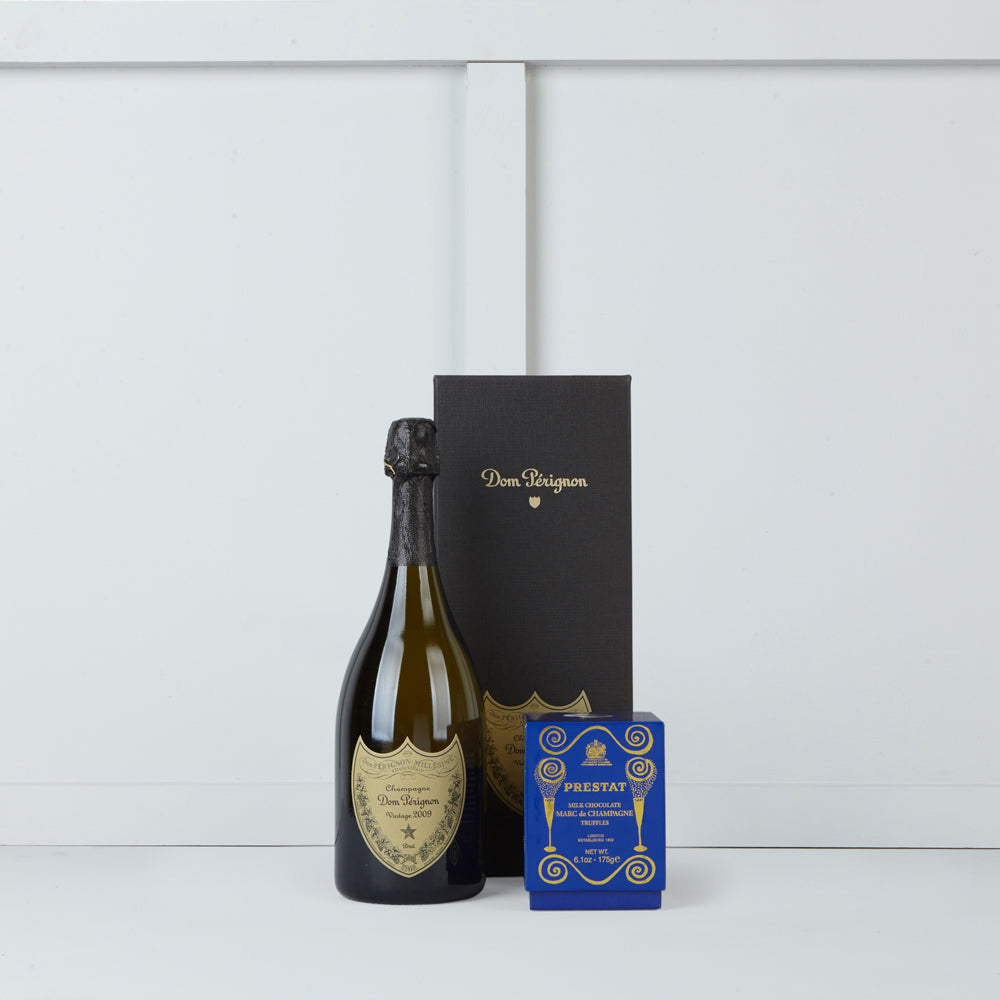 Image of bottle of Dom Perignon & box of Prestat Marc de Champagne Truffles - Sherree Francis Flowers 